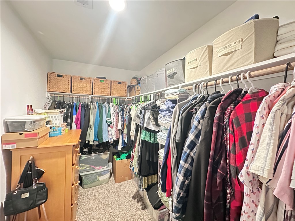 7649 Herd Rider Lane Corpus Christi, TX 78414 - Photo 11 of 18 a view of walk in closet with clothes and shoes