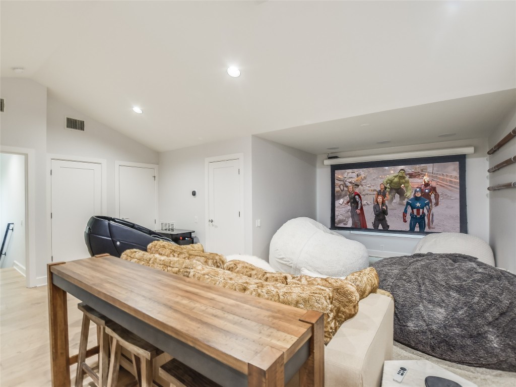 4704 Monte Carmelo Place Austin, TX 78738 - Photo 16 of 30 a bedroom with a bed and painting on the wall