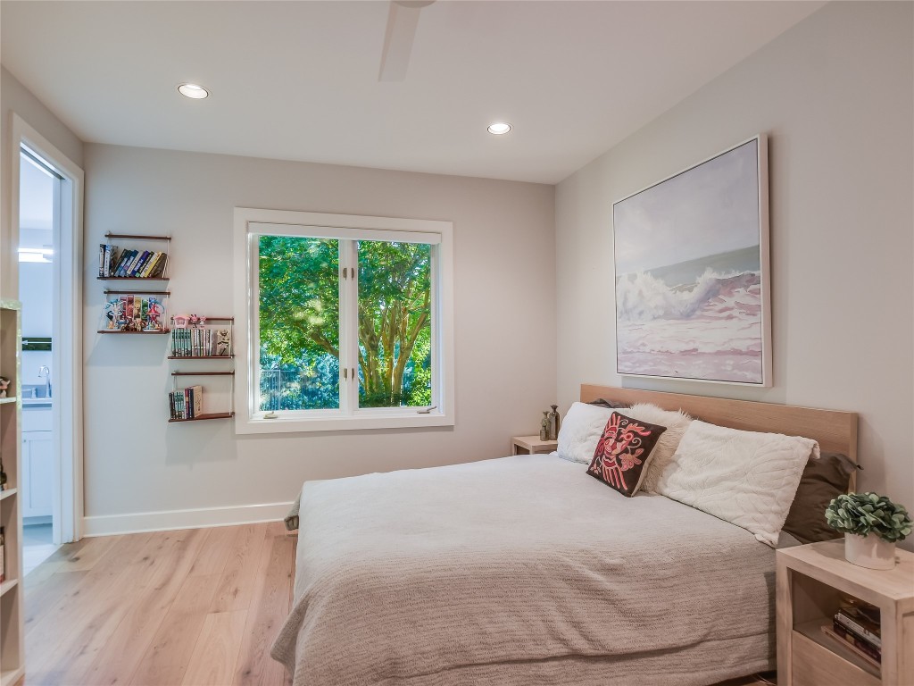 4704 Monte Carmelo Place Austin, TX 78738 - Photo 22 of 30 a bedroom with a large bed and a window