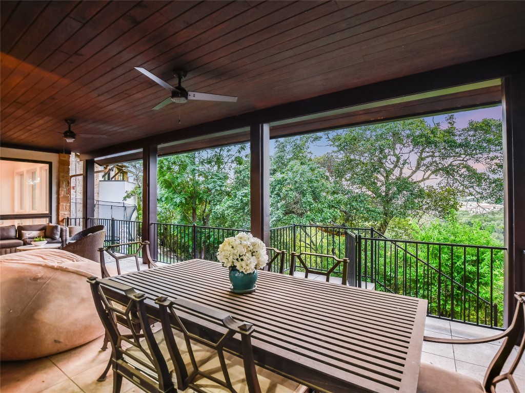 4704 Monte Carmelo Place Austin, TX 78738 - Photo 27 of 30 a view of a patio with a table chairs and a patio