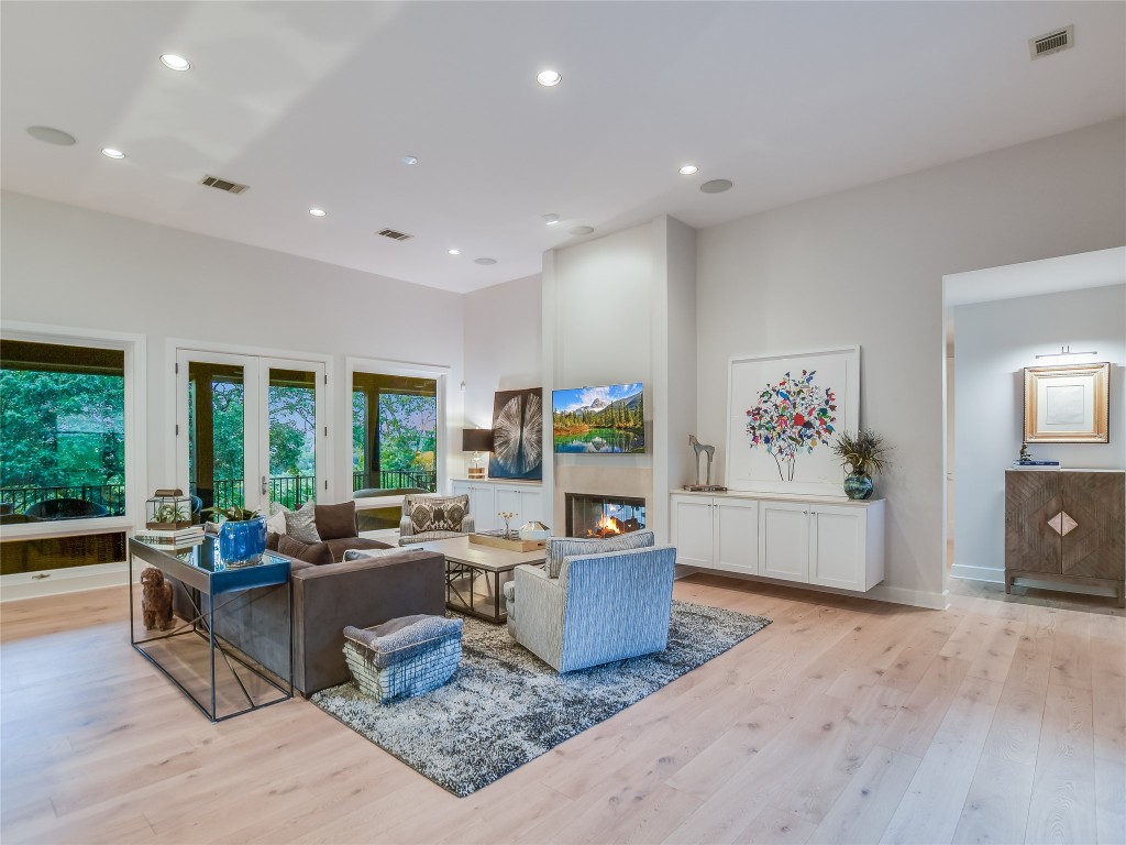 4704 Monte Carmelo Place Austin, TX 78738 - Photo 7 of 30 a living room with furniture and a flat screen tv