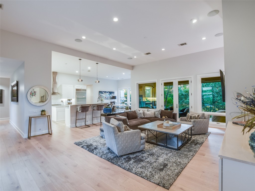 4704 Monte Carmelo Place Austin, TX 78738 - Photo 9 of 30 a living room with furniture and a table
