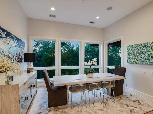 a view of a dining room with furniture window and outside view