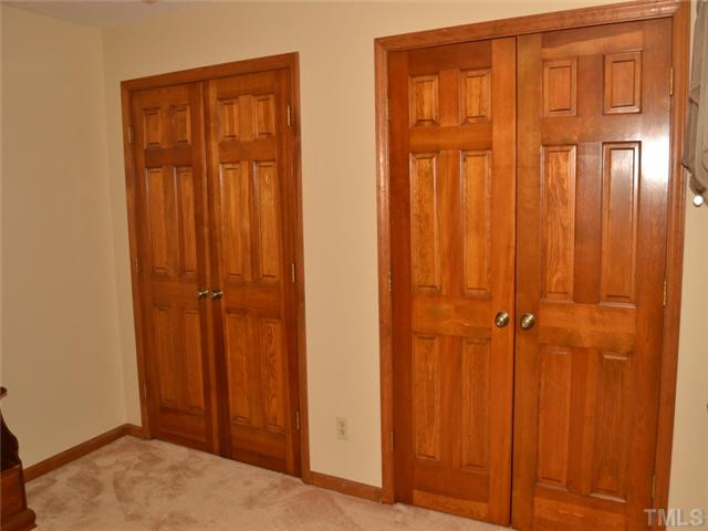 5304 Deep Valley Run Raleigh, NC 27606 - Photo 17 of 25 Generous closets and real wood doors in the secondary bedrooms. Bedroom