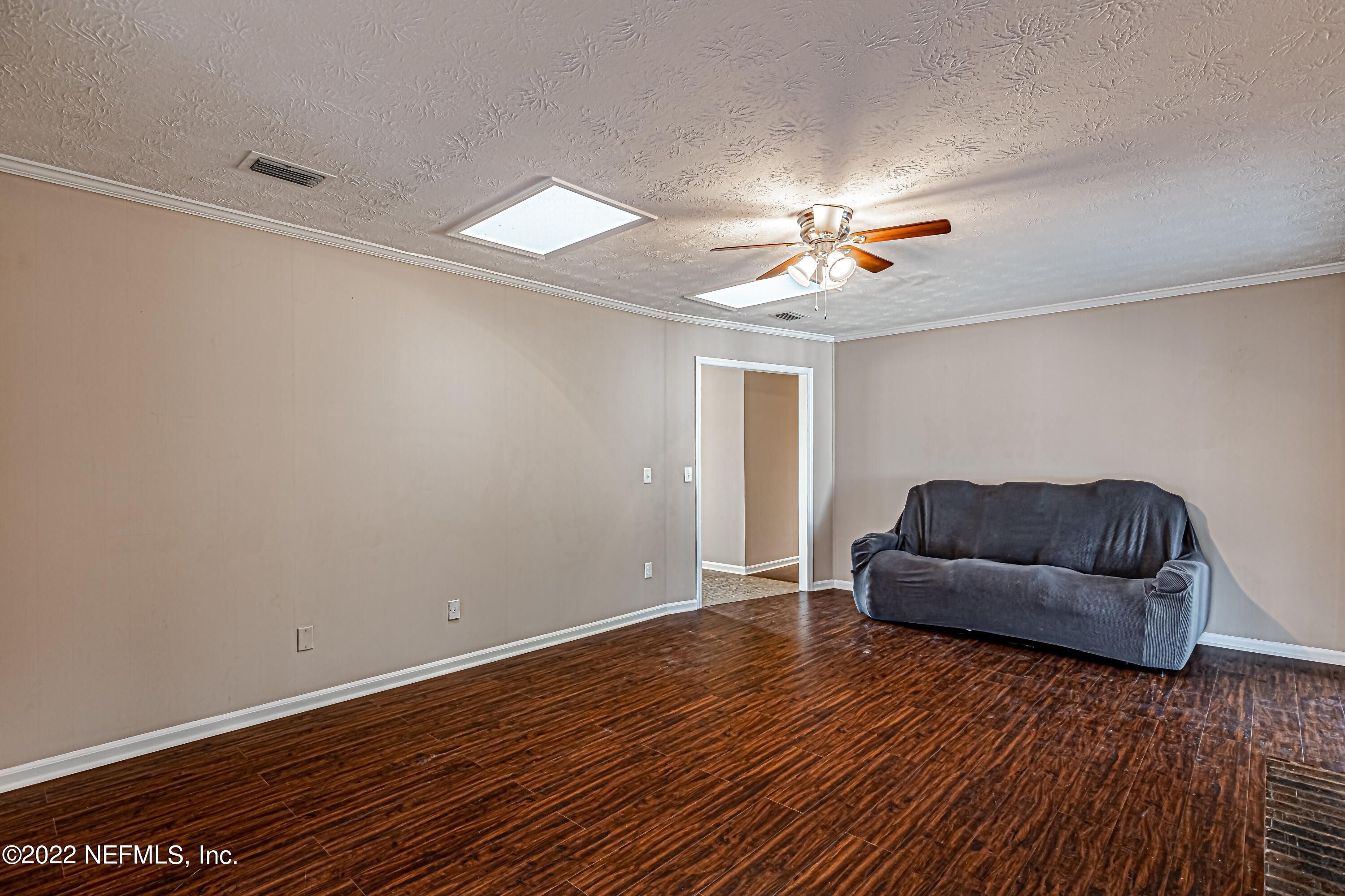 7339 Sandy Bluff Drive Jacksonville, FL 32277 - Photo 13 of 35 a living room with furniture and a wooden floor
