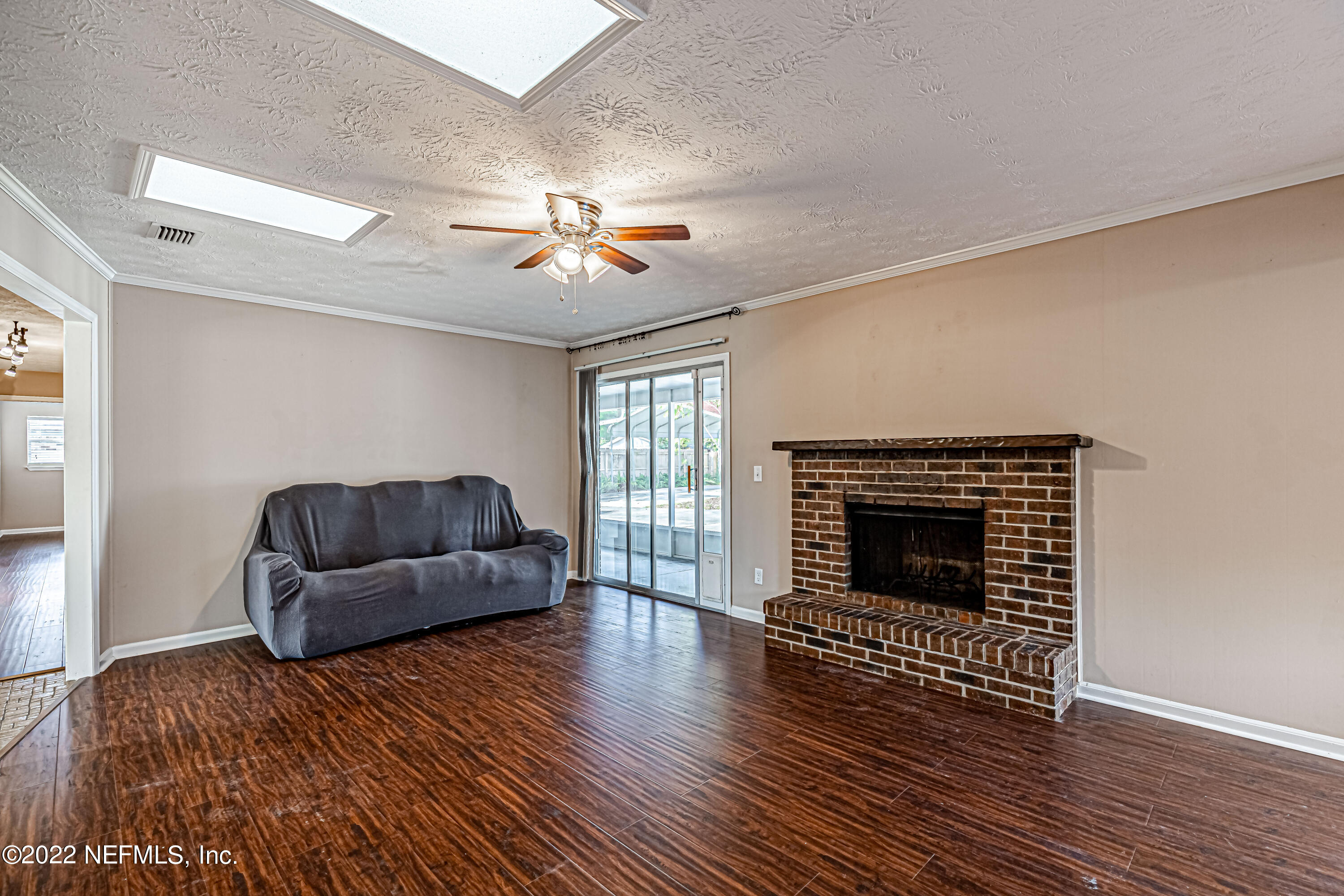 7339 Sandy Bluff Drive Jacksonville, FL 32277 - Photo 14 of 35 a living room with furniture and a fireplace