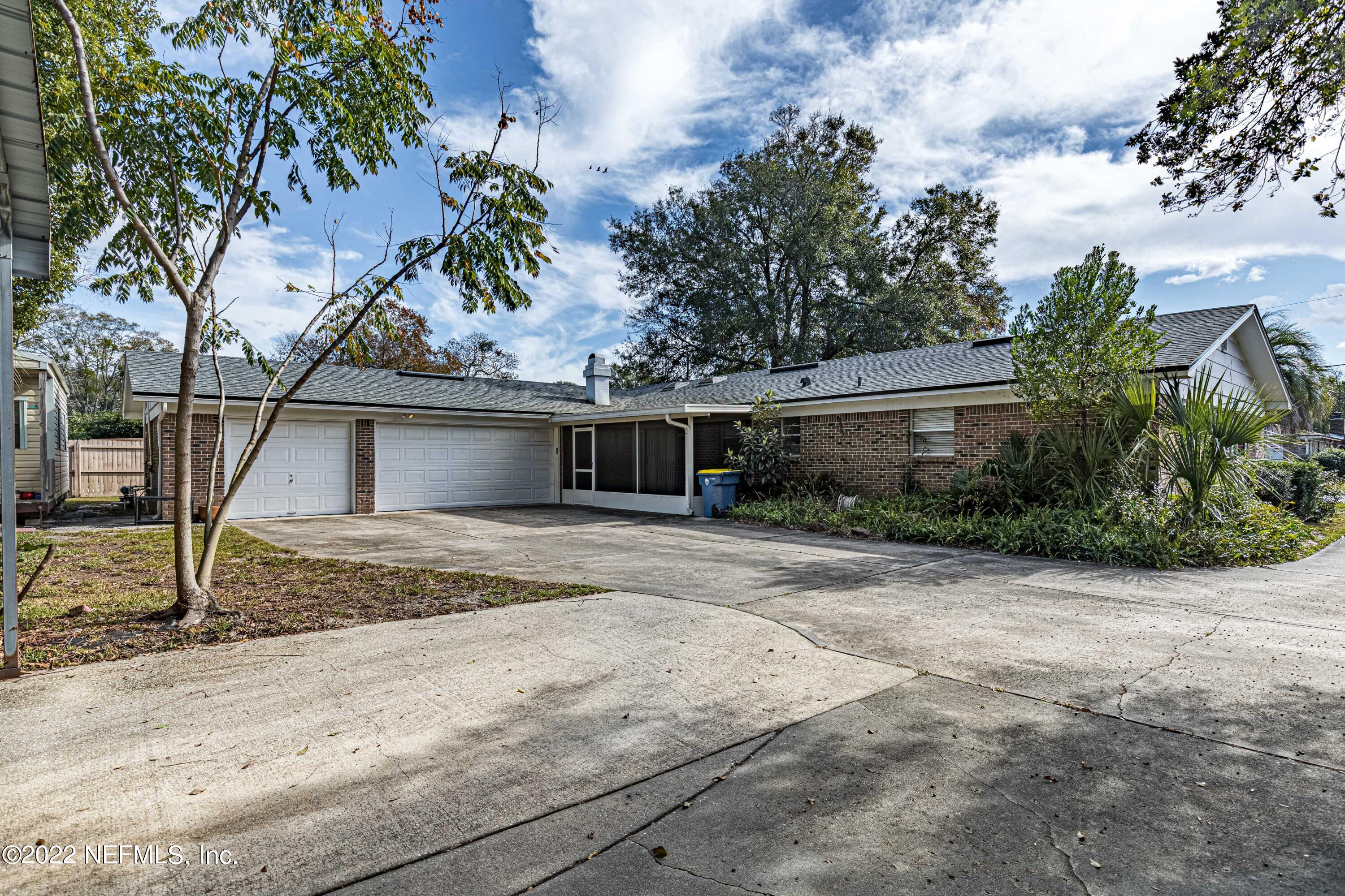 7339 Sandy Bluff Drive Jacksonville, FL 32277 - Photo 30 of 35 a front view of a house with garden