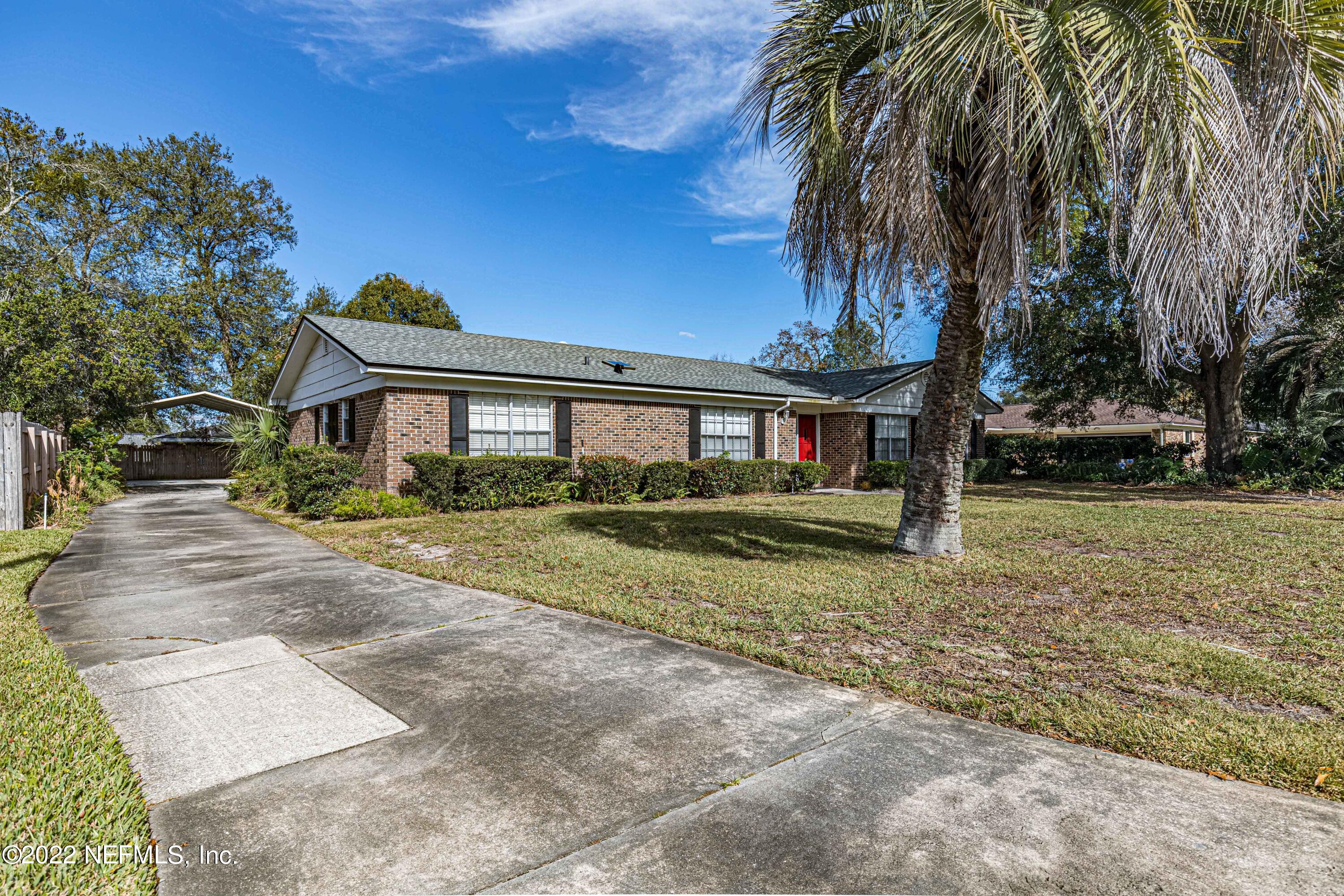 7339 Sandy Bluff Drive Jacksonville, FL 32277 - Photo 3 of 35 a view of a yard in front of a house
