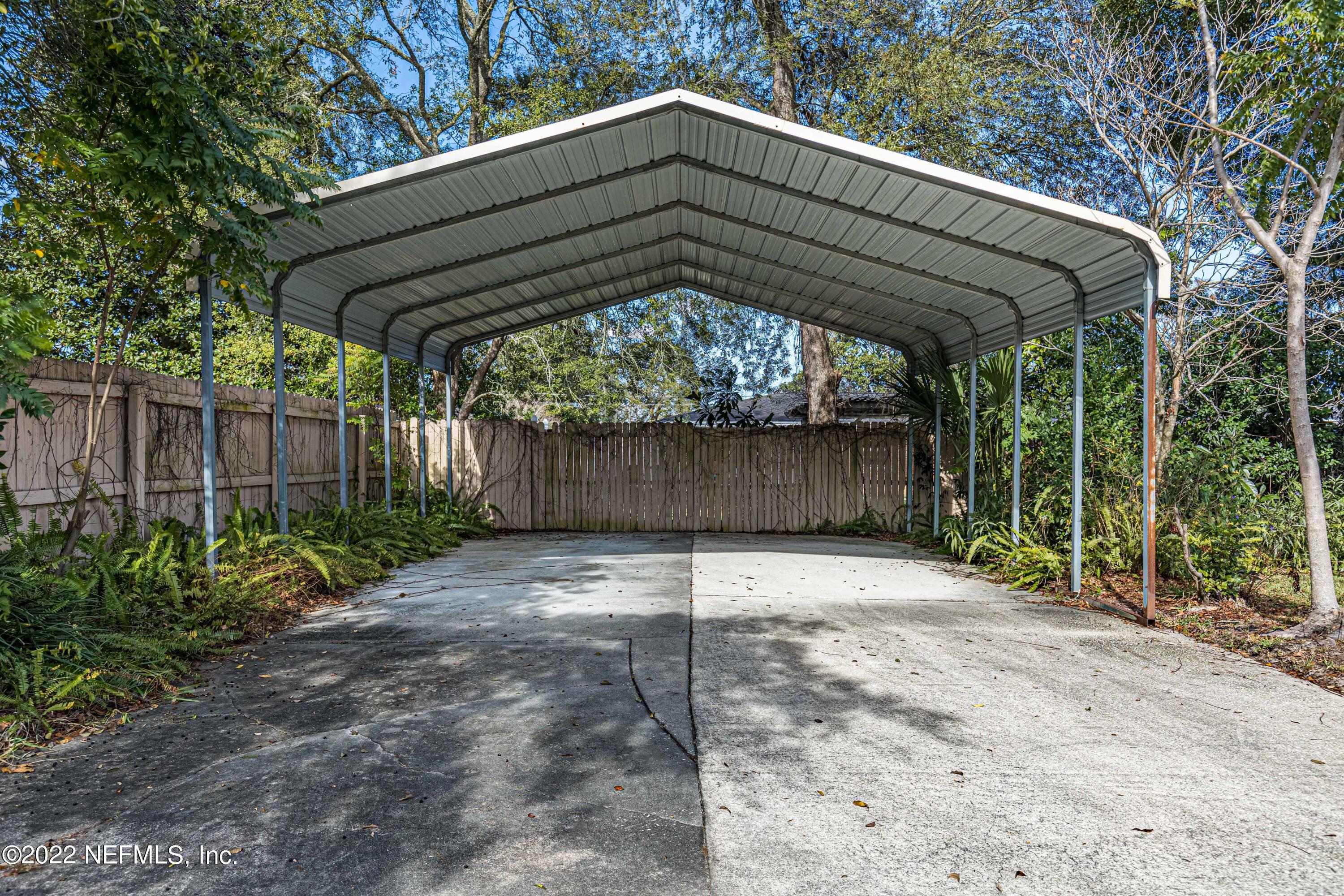 7339 Sandy Bluff Drive Jacksonville, FL 32277 - Photo 35 of 35 a backyard of a house with lots of green space