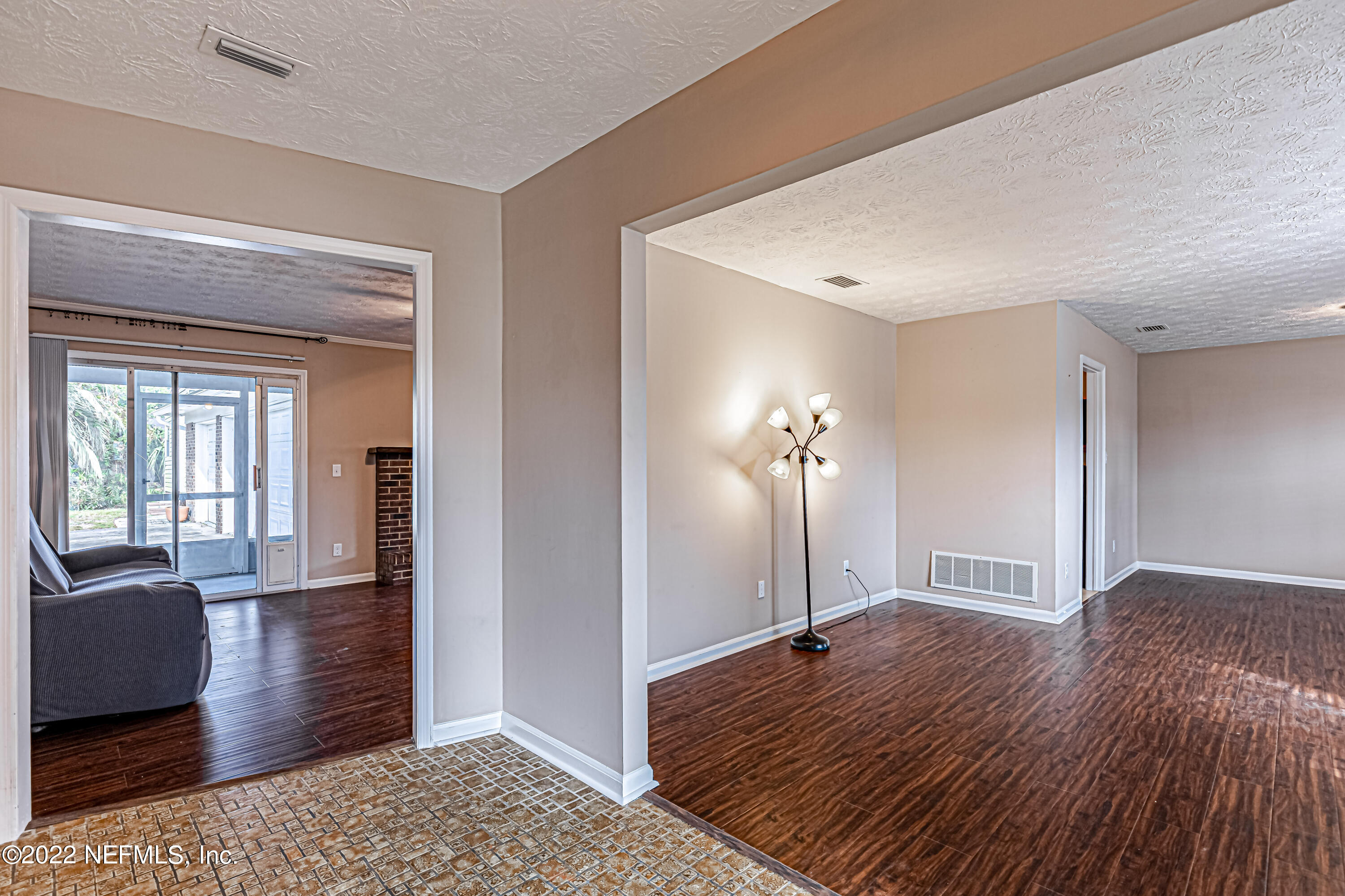 7339 Sandy Bluff Drive Jacksonville, FL 32277 - Photo 7 of 35 a view of a room with window and wooden floor