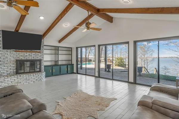 a bedroom with bed and flat screen tv