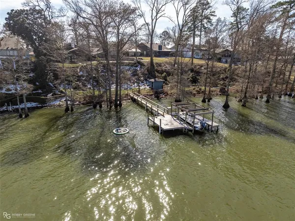 a view of a small pool in the backyard of a house