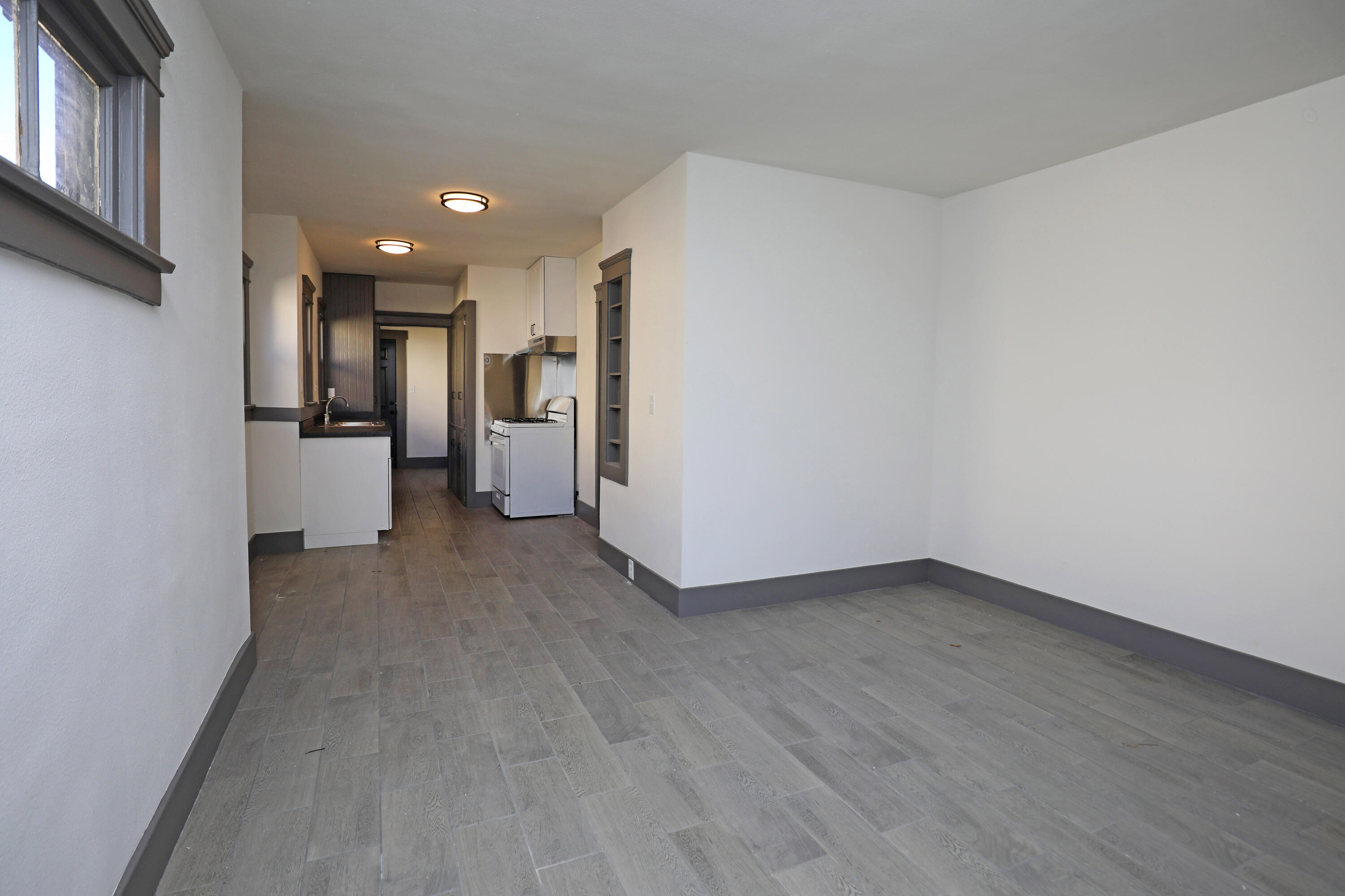 407 North Ojai Road Santa Paula, CA 93060 - Photo 5 of 7 a view of a kitchen with a refrigerator a kitchen counter top space and wooden floor
