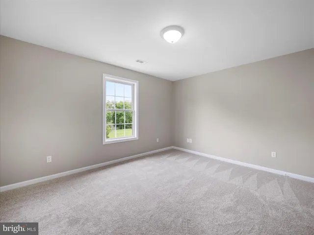 a view of an empty room and entryway