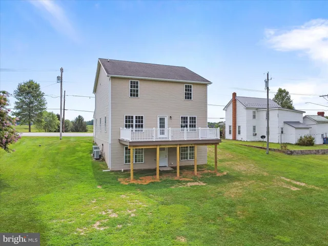a picture of a bench in front of a building