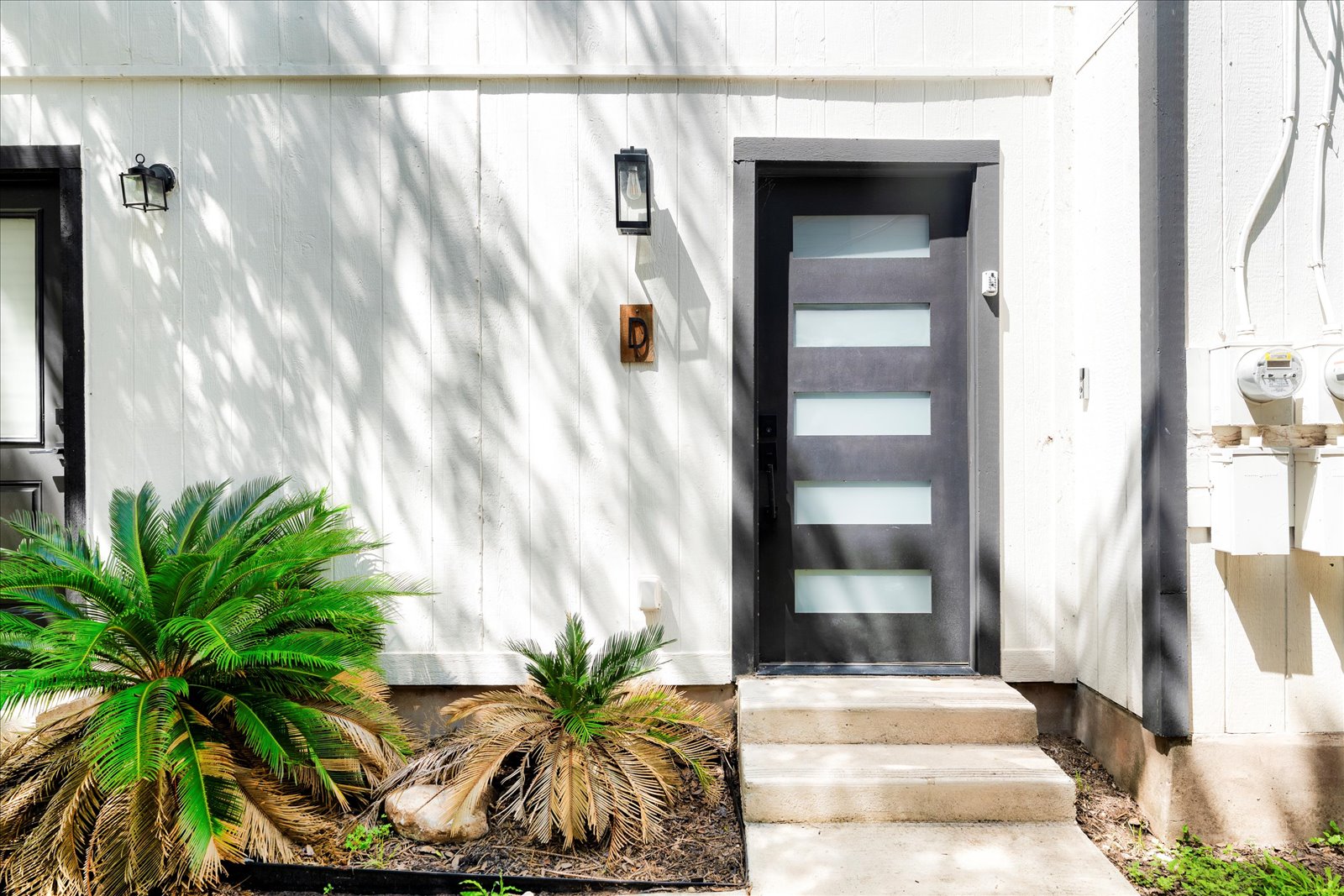 1511 Camp Craft Road, Unit D West Lake Hills, TX 78746 - Photo 12 of 29 a potted plant in front of a door