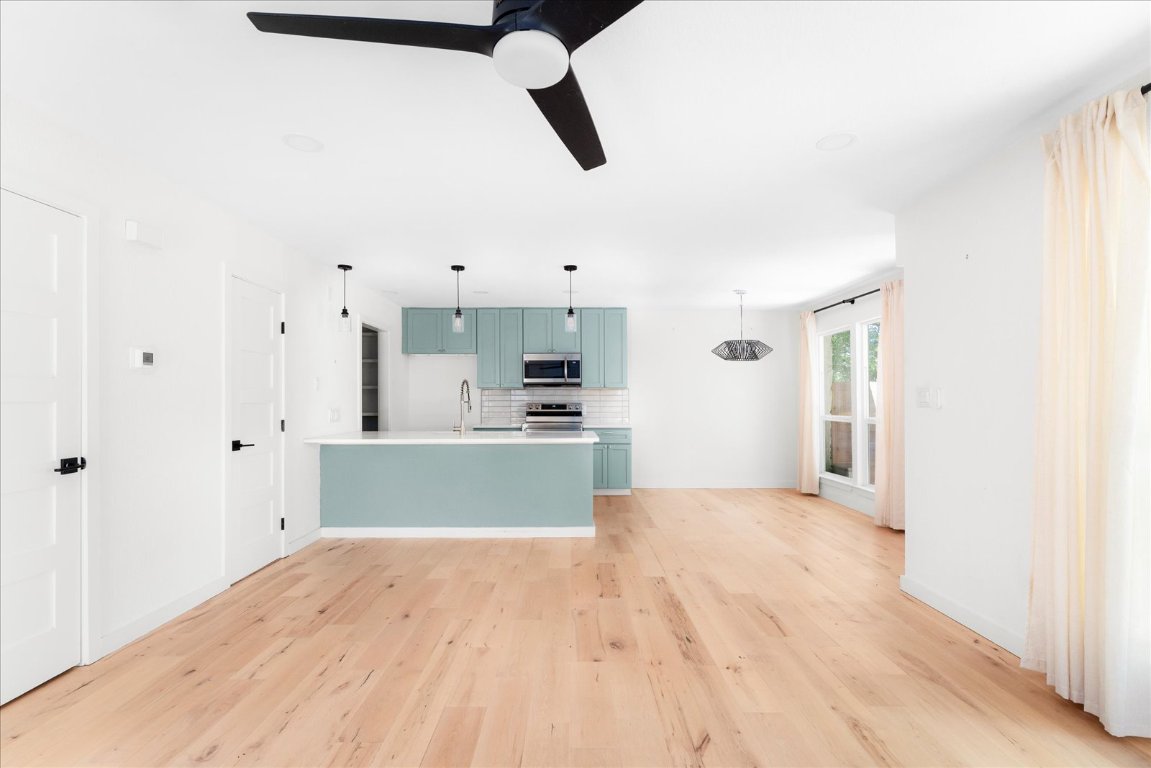 1511 Camp Craft Road, Unit D West Lake Hills, TX 78746 - Photo 15 of 29 a view of kitchen and empty room with wooden floor