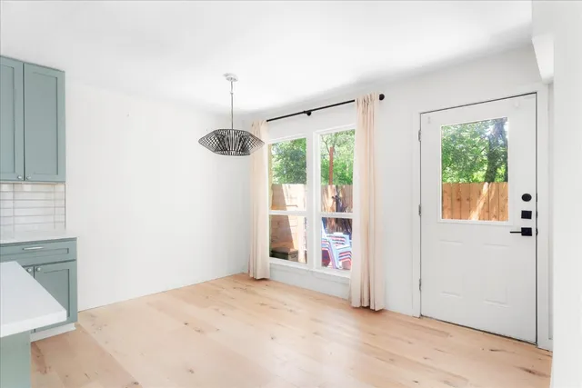 a view of empty room with floor to ceiling window