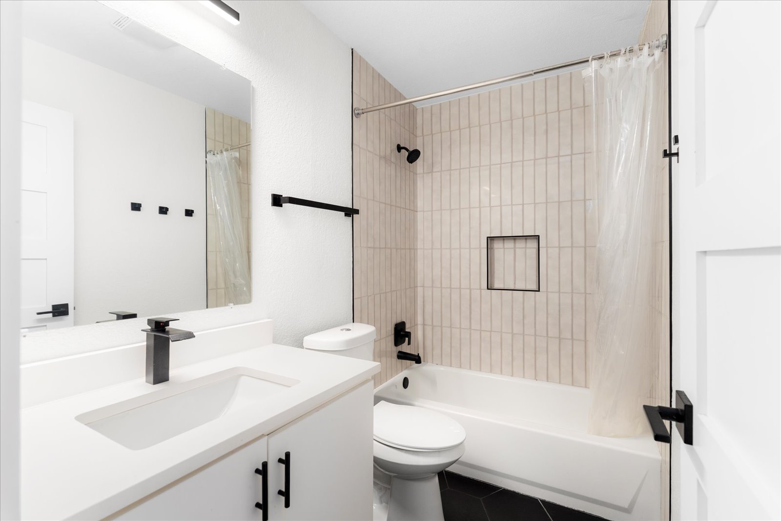 1511 Camp Craft Road, Unit D West Lake Hills, TX 78746 - Photo 24 of 29 a bathroom with a sink a toilet and shower