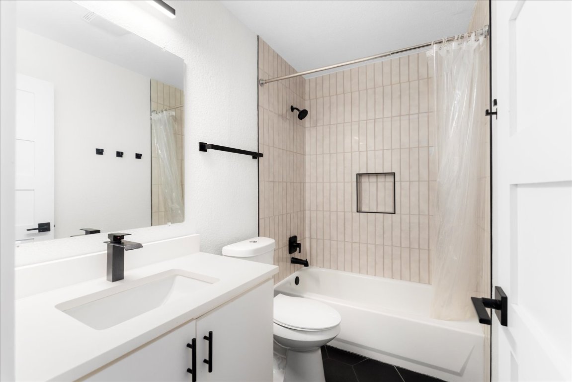 1511 Camp Craft Road, Unit D West Lake Hills, TX 78746 - Photo 24 of 29 a bathroom with a sink a toilet and shower