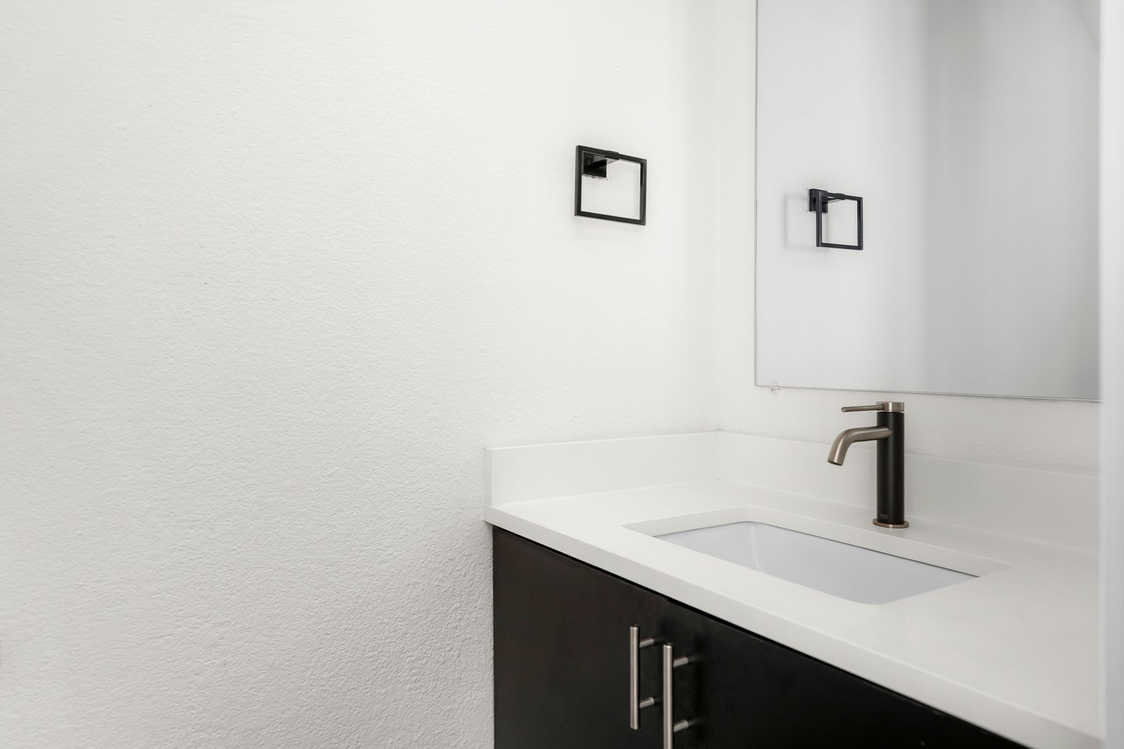 1511 Camp Craft Road, Unit D West Lake Hills, TX 78746 - Photo 28 of 29 a bathroom with a sink and a mirror