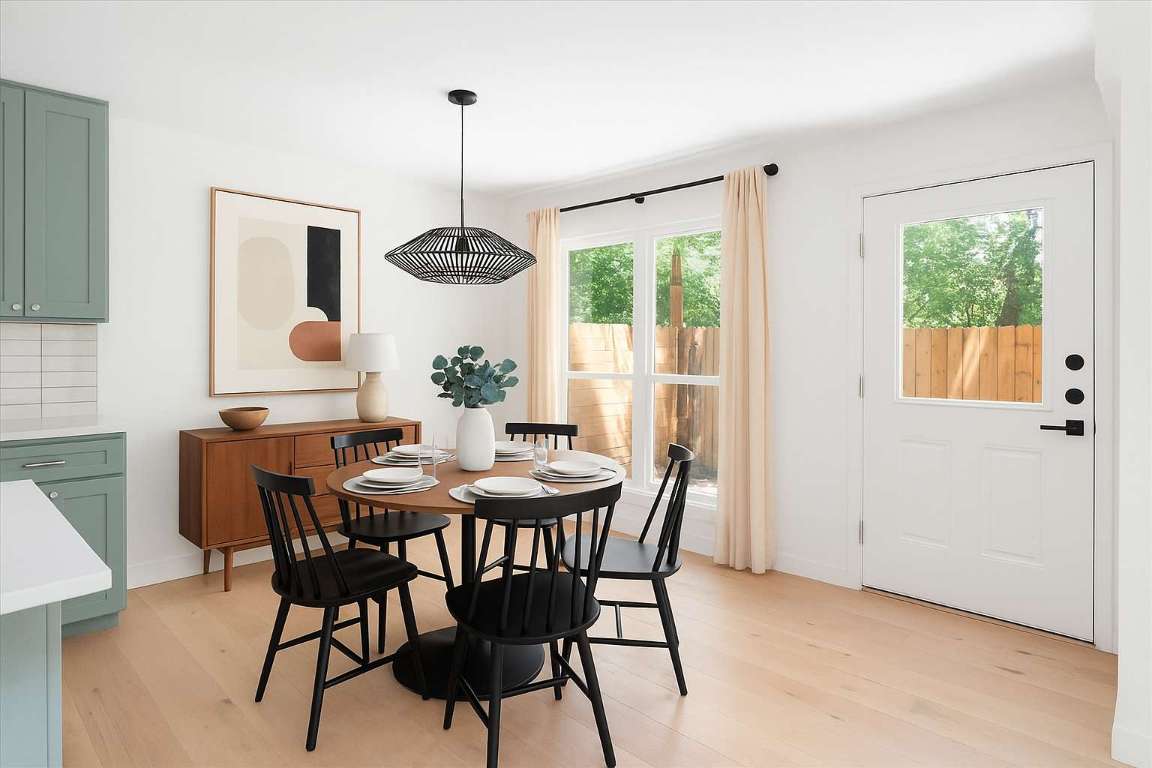 1511 Camp Craft Road, Unit D West Lake Hills, TX 78746 - Photo 3 of 29 a dining room with furniture a chandelier and window