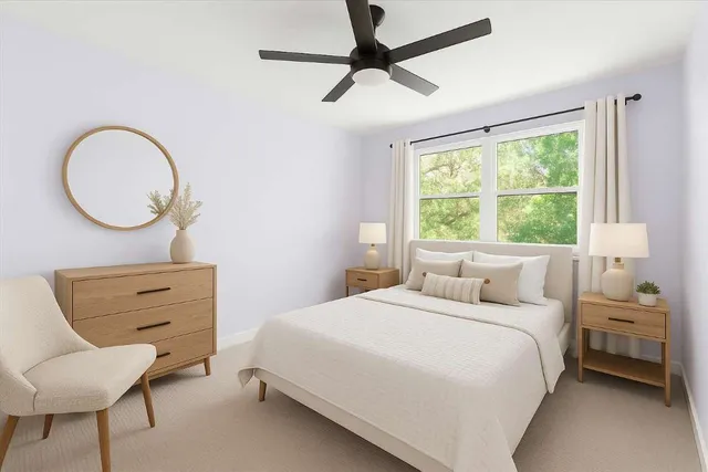 a bedroom with a bed and a chair