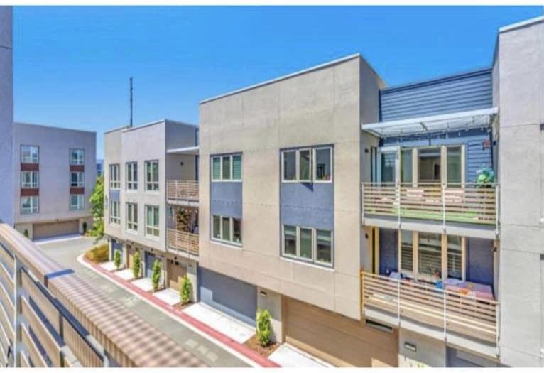 1625 Delano Street, Unit 21 Milpitas, CA 95035 - Photo 1 of 14 a front view of a building with glass windows