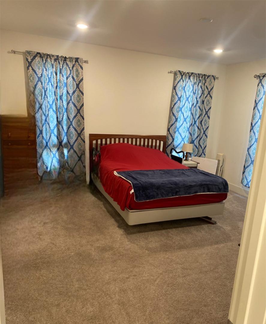 1625 Delano Street, Unit 21 Milpitas, CA 95035 - Photo 5 of 14 a bedroom with a bed and a window