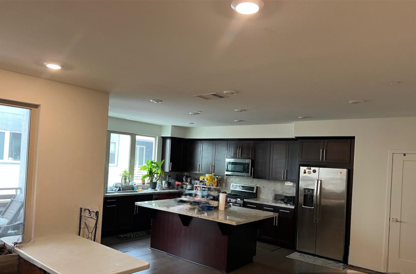 1625 Delano Street, Unit 21 Milpitas, CA 95035 - Photo 7 of 14 a kitchen with refrigerator and cabinets