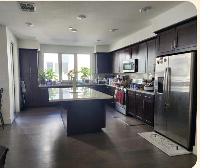 1625 Delano Street, Unit 21 Milpitas, CA 95035 - Photo 9 of 14 a kitchen with stainless steel appliances granite countertop a refrigerator a sink a stove and oven