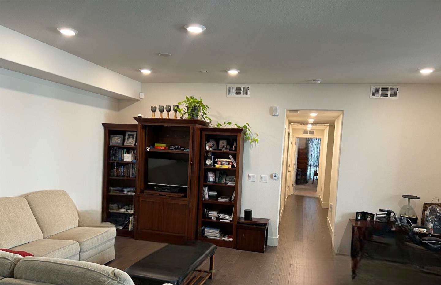 1625 Delano Street, Unit 21 Milpitas, CA 95035 - Photo 10 of 14 a living room with furniture and a flat screen tv