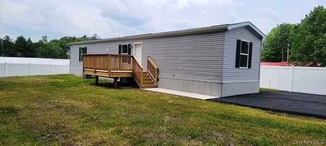 a view of a house with a back yard