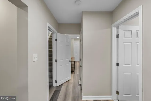a living room with furniture floor to ceiling window and fire place