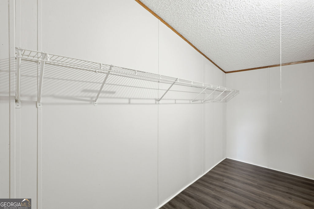 196 Barn Rd Circle Jesup, GA 31545 - Photo 19 of 31 a view of a room with wooden floor