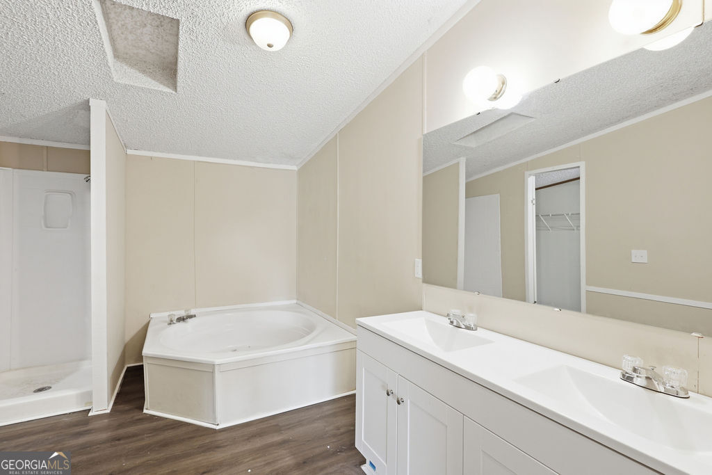 196 Barn Rd Circle Jesup, GA 31545 - Photo 20 of 31 a bathroom with a sink and a mirror