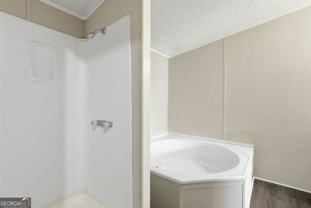 196 Barn Rd Circle Jesup, GA 31545 - Photo 21 of 31 a bathroom with a sink and shower
