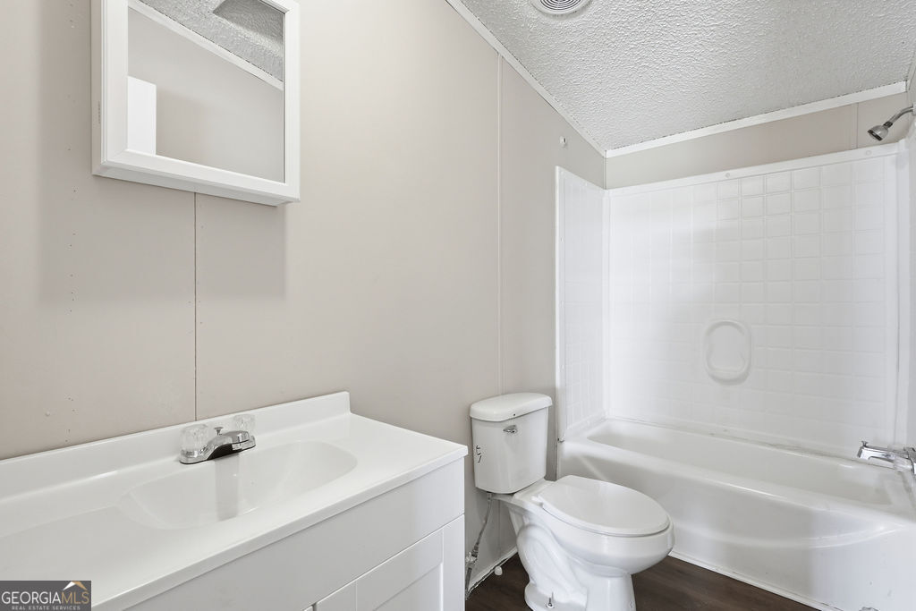 196 Barn Rd Circle Jesup, GA 31545 - Photo 24 of 31 a bathroom with a sink toilet and shower