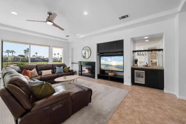 a kitchen with granite countertop stainless steel appliances and refrigerator