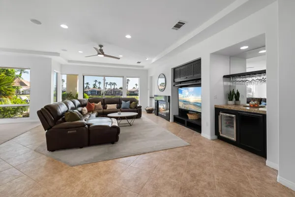 a kitchen with a appliances dining table and chairs