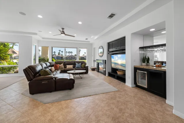 a kitchen with a appliances dining table and chairs