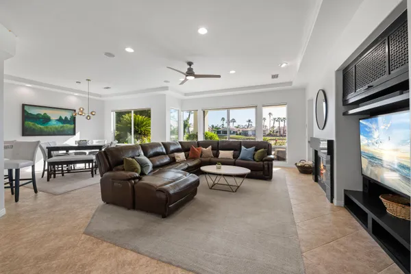 a kitchen with granite countertop white cabinets and stainless steel appliances
