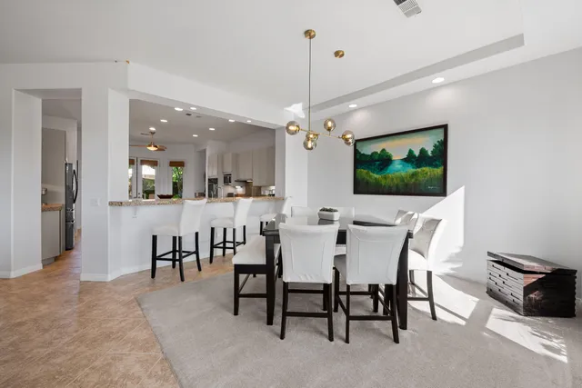 a spacious bedroom with a large bed and a large window