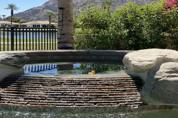 a view of a house with outdoor space and lake view