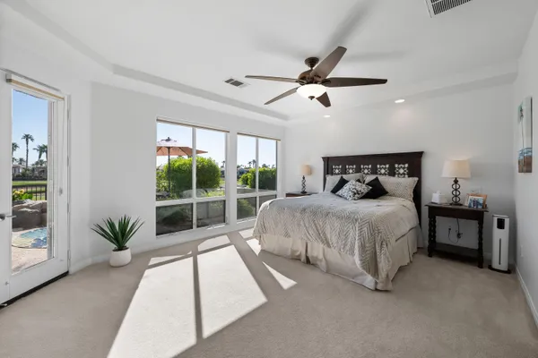 a view of swimming pool with outdoor seating and plants