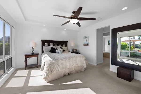 a swimming pool with outdoor seating and yard