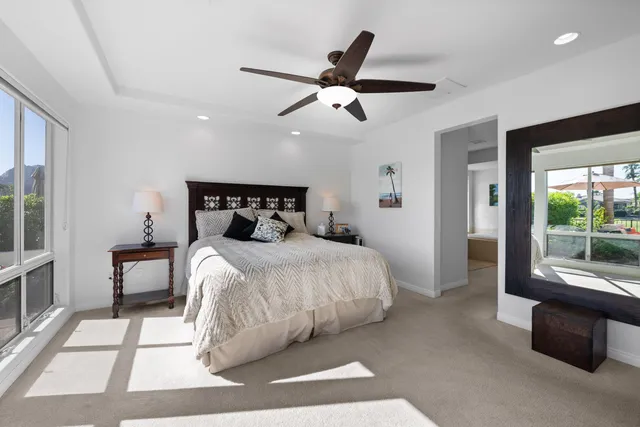 a swimming pool with outdoor seating and yard