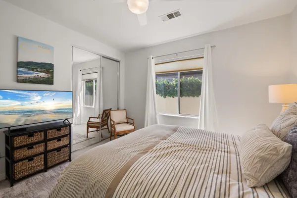 an aerial view of a house with a garden and lake view