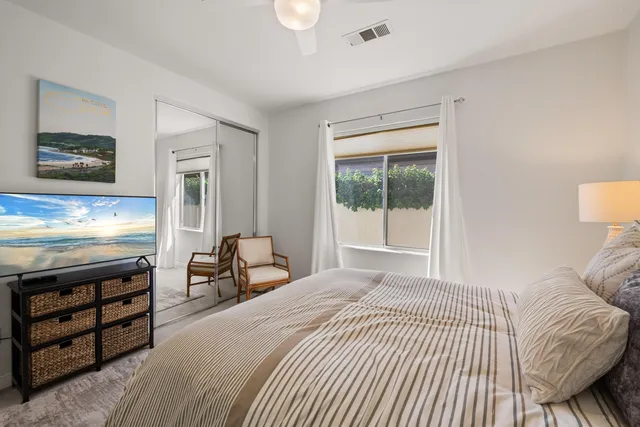 an aerial view of a house with a garden and lake view