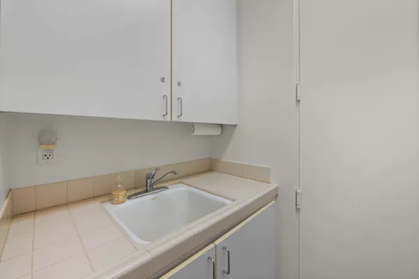 an aerial view of residential house and sandy dunes